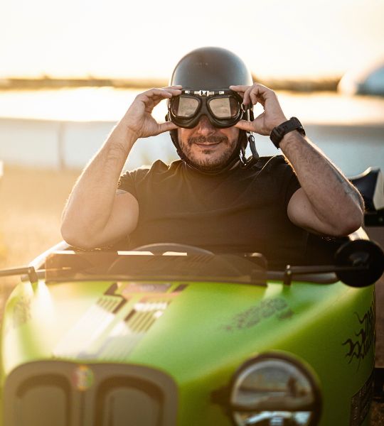 Participant driving a green retro hot rod during a sunset tour in Aveiro, Portugal – HotRodFun Portugal experience”